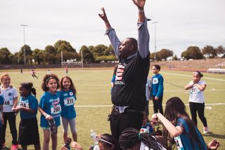 Craig Aarons-Martin and his students participating in the New Balance 5K